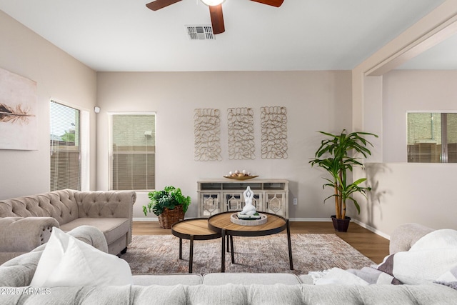 living room with hardwood / wood-style floors and ceiling fan