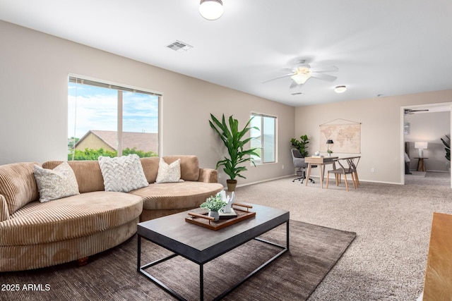 living room with carpet floors and ceiling fan