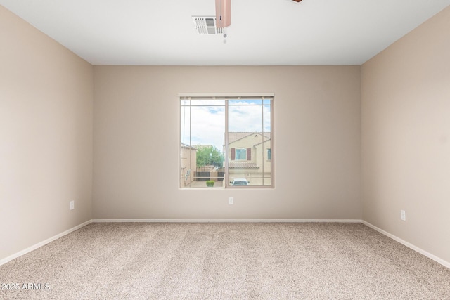 unfurnished room featuring carpet