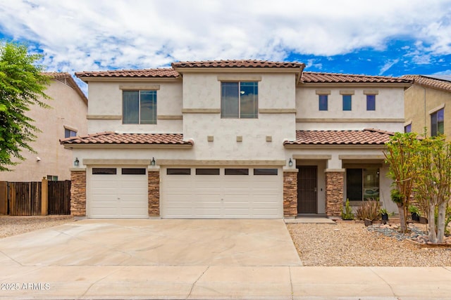 mediterranean / spanish home featuring a garage