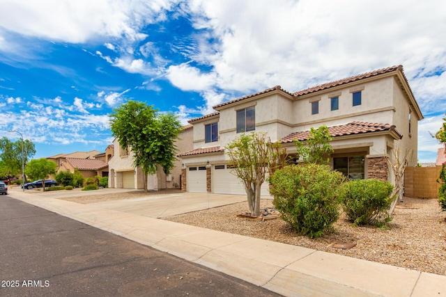 mediterranean / spanish-style home with a garage