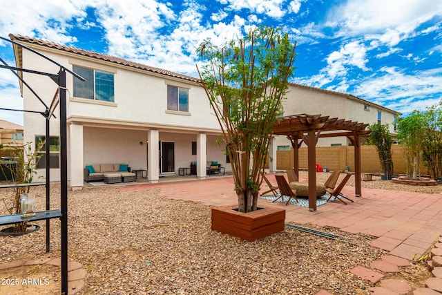 rear view of house featuring a pergola, outdoor lounge area, and a patio