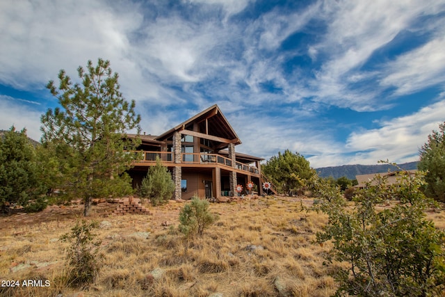 rear view of property with a deck