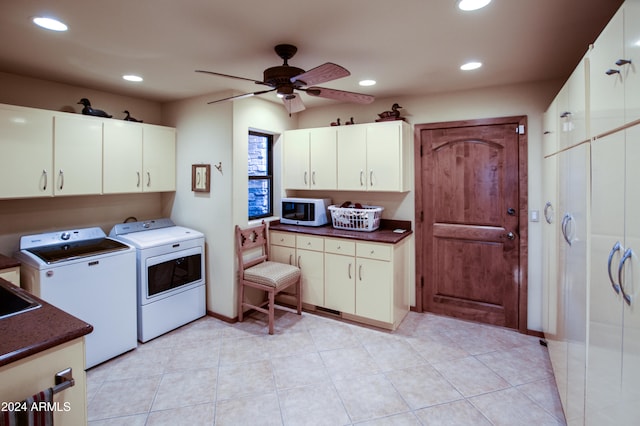 laundry room featuring cabinets, light tile patterned floors, ceiling fan, and washing machine and clothes dryer