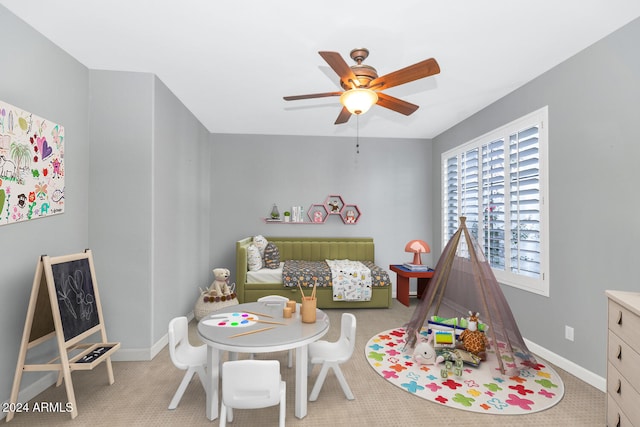 game room featuring ceiling fan and light colored carpet