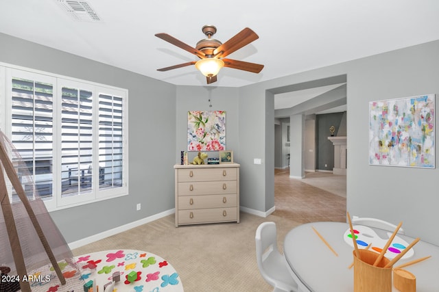 bedroom featuring ceiling fan and light colored carpet