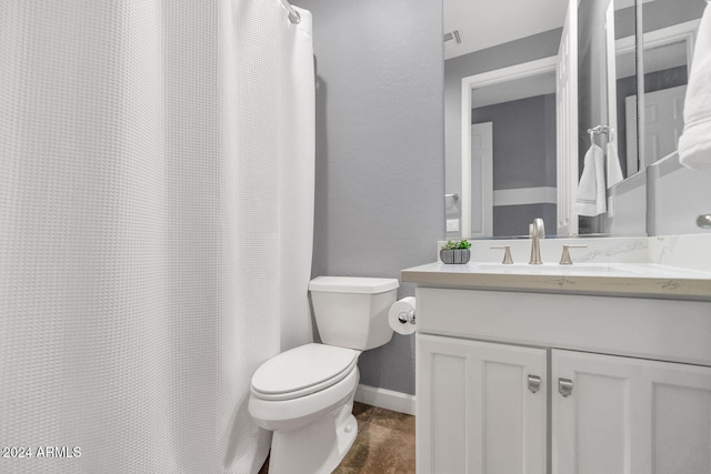 bathroom with toilet and vanity