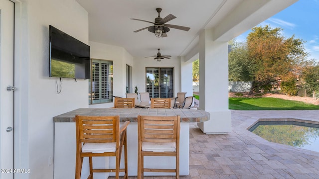 view of patio / terrace featuring ceiling fan