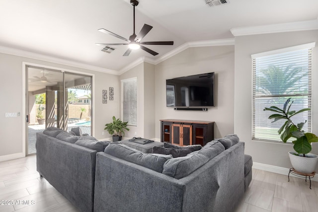 living area with a ceiling fan, baseboards, vaulted ceiling, and ornamental molding