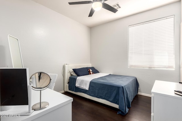 bedroom with baseboards, dark wood-style flooring, visible vents, and multiple windows