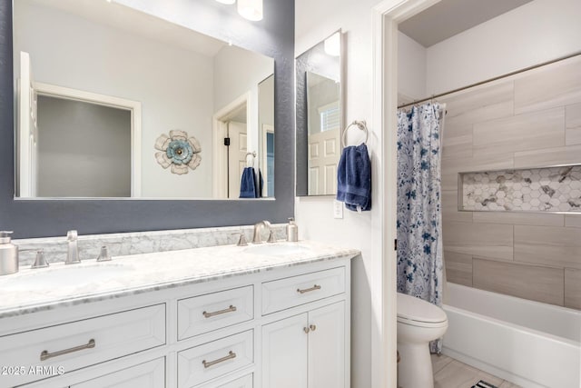 full bathroom with double vanity, a sink, shower / bath combo, and toilet