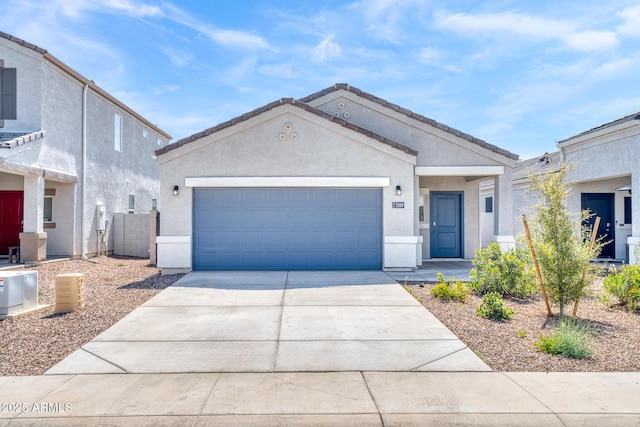 5269 E Gummite Dr, San Tan Valley, AZ 85143 - view of front of home featuring stucco siding, concrete driveway, and a garage