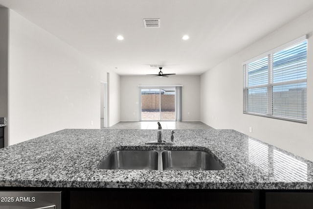 5269 E Gummite Dr, San Tan Valley, AZ 85143 - kitchen featuring open floor plan, a sink, stone counters, visible vents, and a ceiling fan