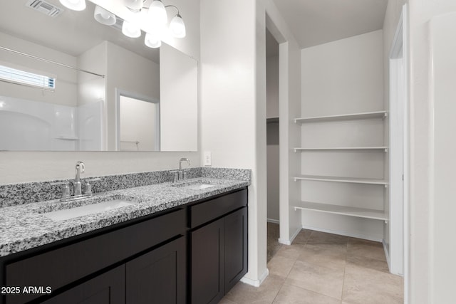 5269 E Gummite Dr, San Tan Valley, AZ 85143 - bathroom featuring a sink, double vanity, visible vents, and tile patterned flooring