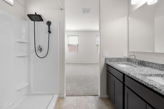 5269 E Gummite Dr, San Tan Valley, AZ 85143 - full bathroom with double vanity, a sink, tile patterned floors, and a shower