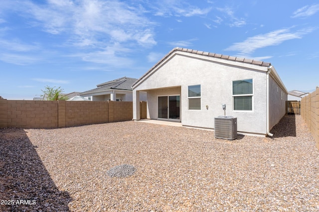 5269 E Gummite Dr, San Tan Valley, AZ 85143 - rear view of house with a fenced backyard, central AC unit, and stucco siding
