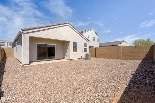 5269 E Gummite Dr, San Tan Valley, AZ 85143 - back of house featuring stucco siding, central air condition unit, a patio, a fenced backyard, and a tiled roof