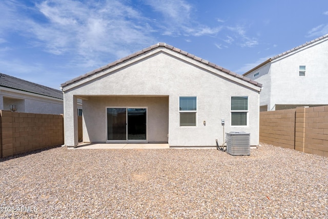 5269 E Gummite Dr, San Tan Valley, AZ 85143 - back of property with fence, a tiled roof, stucco siding, cooling unit, and a patio area