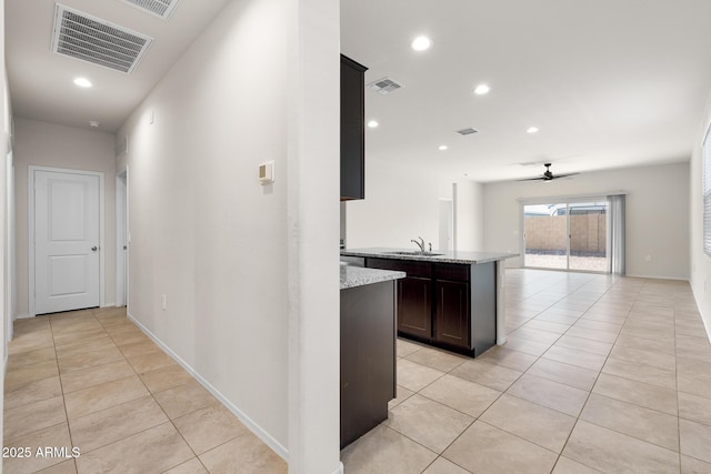 5269 E Gummite Dr, San Tan Valley, AZ 85143 - hall featuring light tile patterned flooring, visible vents, recessed lighting, and a sink