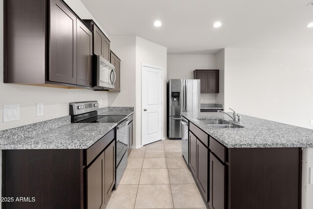 5269 E Gummite Dr, San Tan Valley, AZ 85143 - kitchen featuring a sink, stainless steel appliances, a kitchen island with sink, recessed lighting, and dark brown cabinets