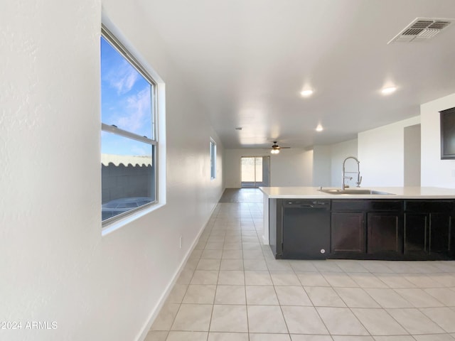 kitchen with dishwasher, ceiling fan, light tile patterned floors, and sink