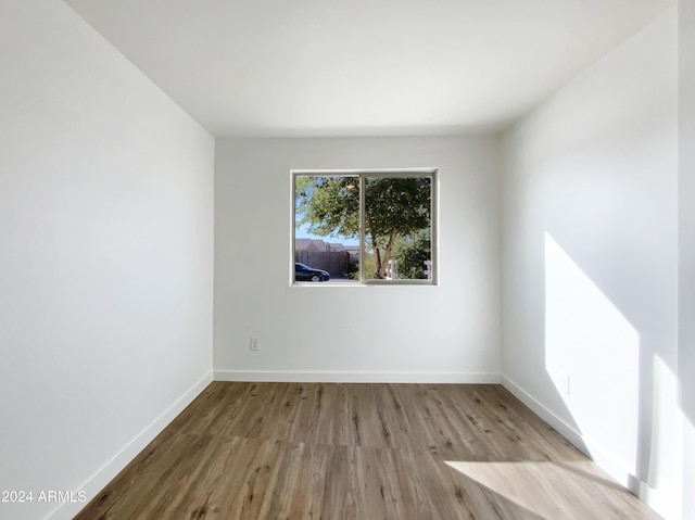 unfurnished room featuring light wood-type flooring