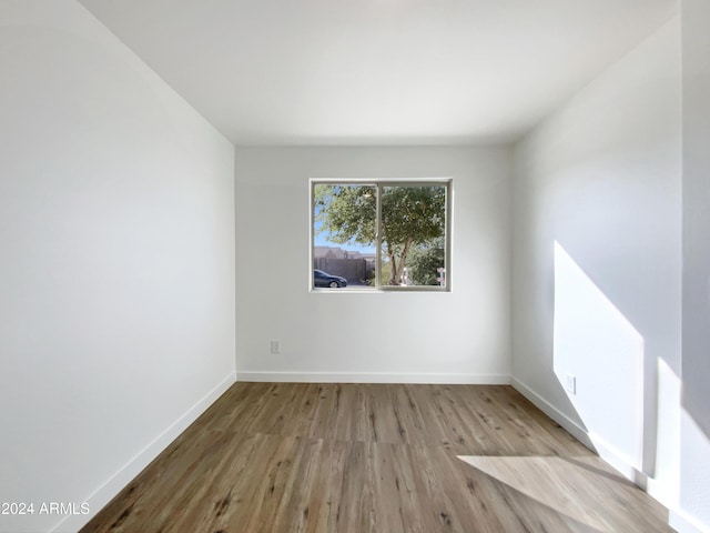 spare room with light wood-type flooring