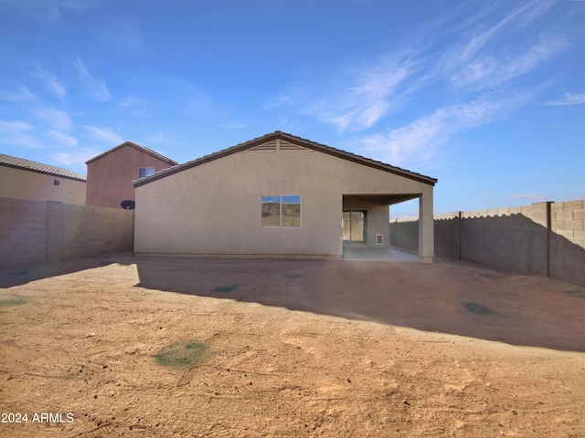 rear view of property featuring a patio area