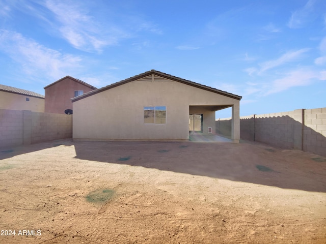 back of house with a patio area