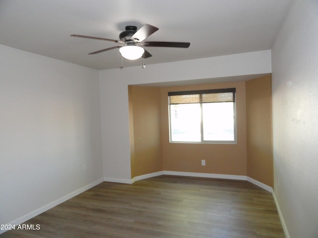 unfurnished room featuring hardwood / wood-style floors and ceiling fan