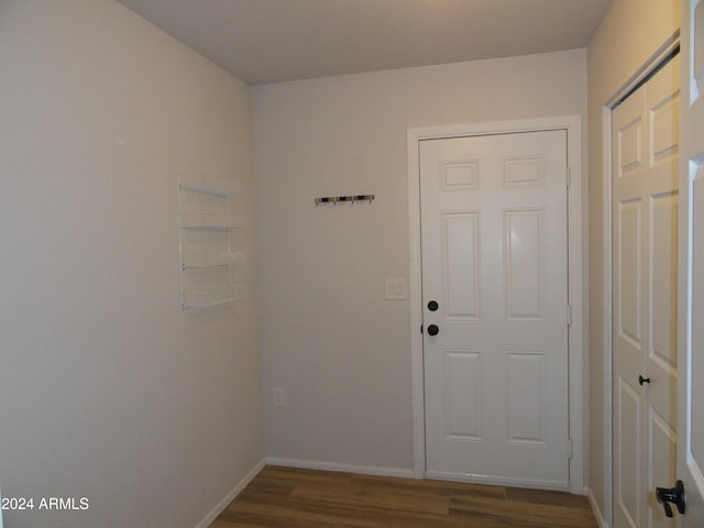 doorway with dark hardwood / wood-style floors