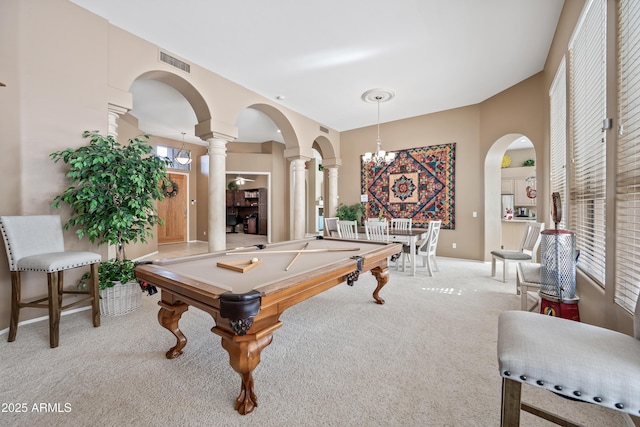 rec room featuring baseboards, visible vents, arched walkways, light colored carpet, and ornate columns