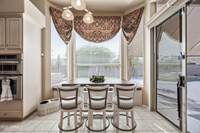 dining area featuring light tile patterned floors