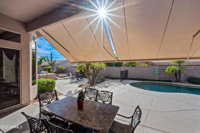 view of pool featuring a fenced in pool, outdoor dining space, a patio area, and a fenced backyard