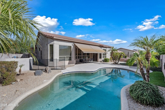 view of pool with a fenced in pool, a patio area, and fence