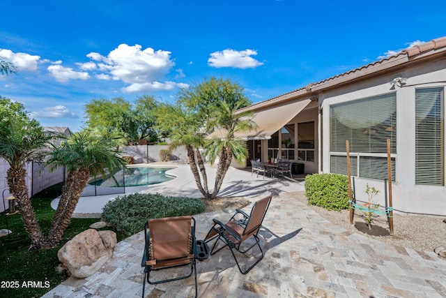 view of patio featuring a fenced backyard and a fenced in pool