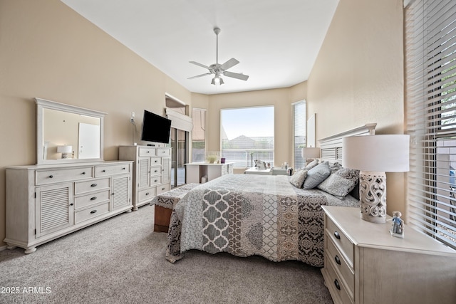 bedroom featuring ceiling fan and light colored carpet