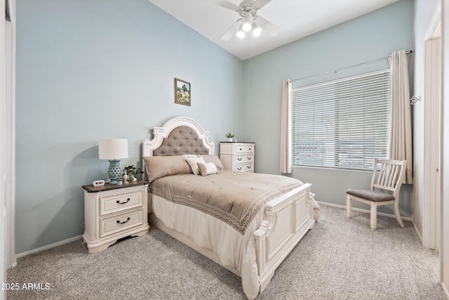 bedroom with baseboards, a ceiling fan, and light colored carpet