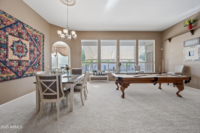 recreation room with arched walkways, a healthy amount of sunlight, carpet flooring, and pool table