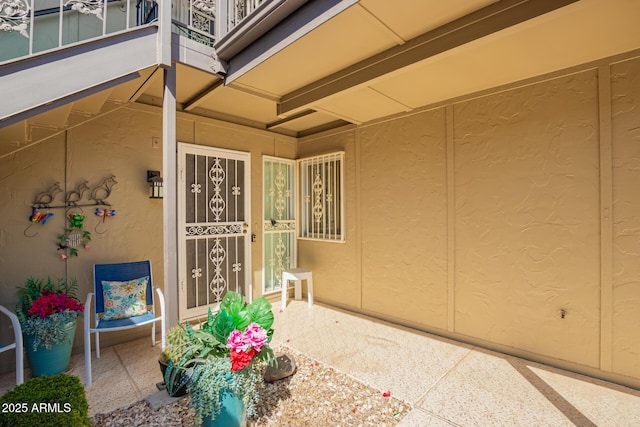 doorway to property with stucco siding