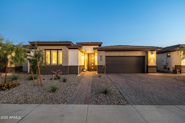 1567 W Camina Plata, San Tan Valley, AZ 85140 - prairie-style home featuring a garage, driveway, and stucco siding
