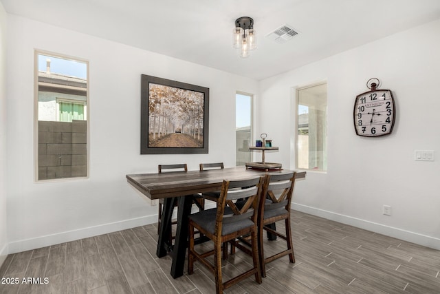 1567 W Camina Plata, San Tan Valley, AZ 85140 - dining area featuring baseboards and wood finished floors