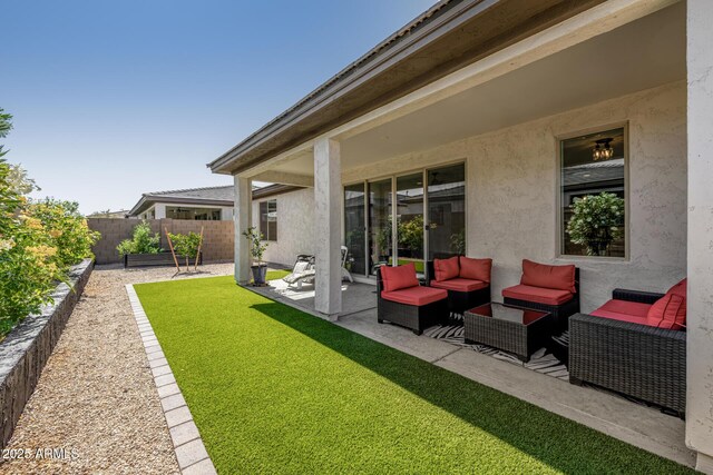1567 W Camina Plata, San Tan Valley, AZ 85140 - view of yard featuring a patio area and an outdoor hangout area