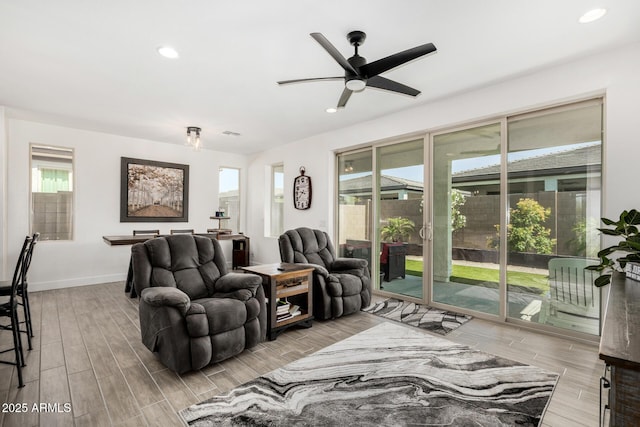 1567 W Camina Plata, San Tan Valley, AZ 85140 - living room featuring healthy amount of natural light, ceiling fan, recessed lighting, and wood finished floors