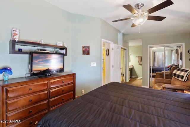 bedroom featuring connected bathroom and ceiling fan