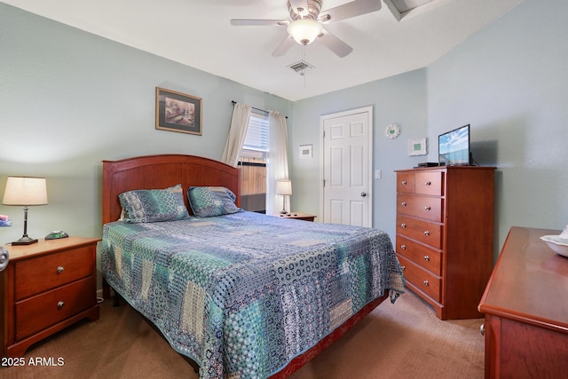 carpeted bedroom with visible vents and ceiling fan