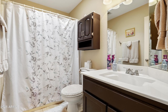 bathroom featuring curtained shower, toilet, vanity, and tile patterned flooring