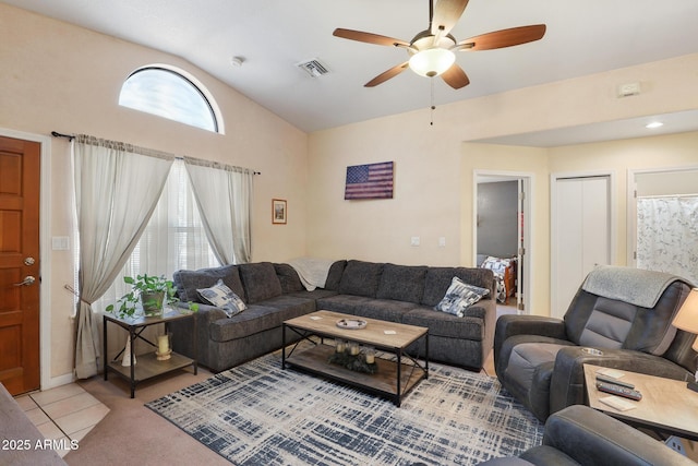 living room featuring visible vents, light colored carpet, lofted ceiling, and a ceiling fan