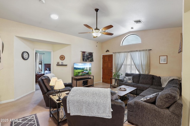 living area featuring a ceiling fan, visible vents, baseboards, lofted ceiling, and light colored carpet