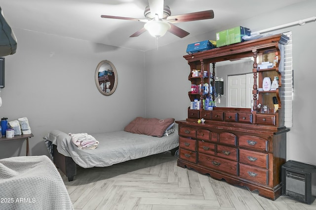 bedroom with ceiling fan and light parquet flooring